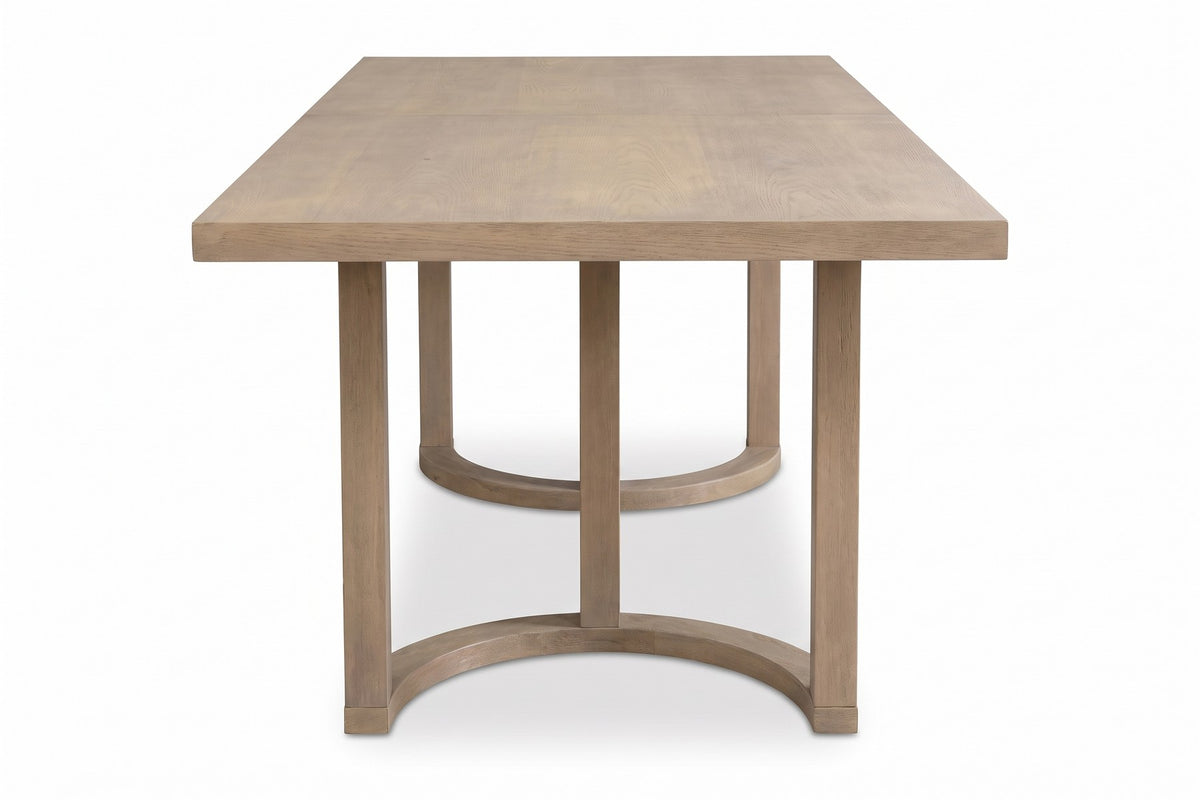 Villette 95-inch light ash dining table with U-shaped bases, end view along the short side, showing the three square posts and the curved floor rail of the near base on a white background