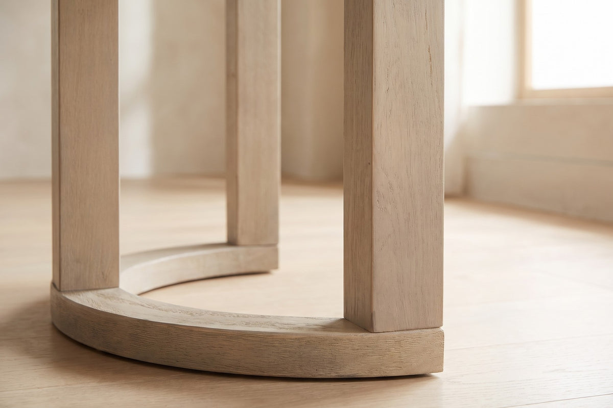 Close-up of one base where the square posts meet the curved half-ring floor rail (Villette)