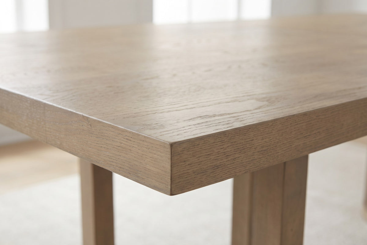 Close-up of one corner of the thick square-edged top, showing the light ash wood grain (Villette)